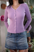 Load image into Gallery viewer, Person wearing a purple ribbed sweater and denim shorts with a blurred background
